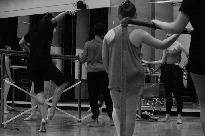 Dancers at barre in black and white